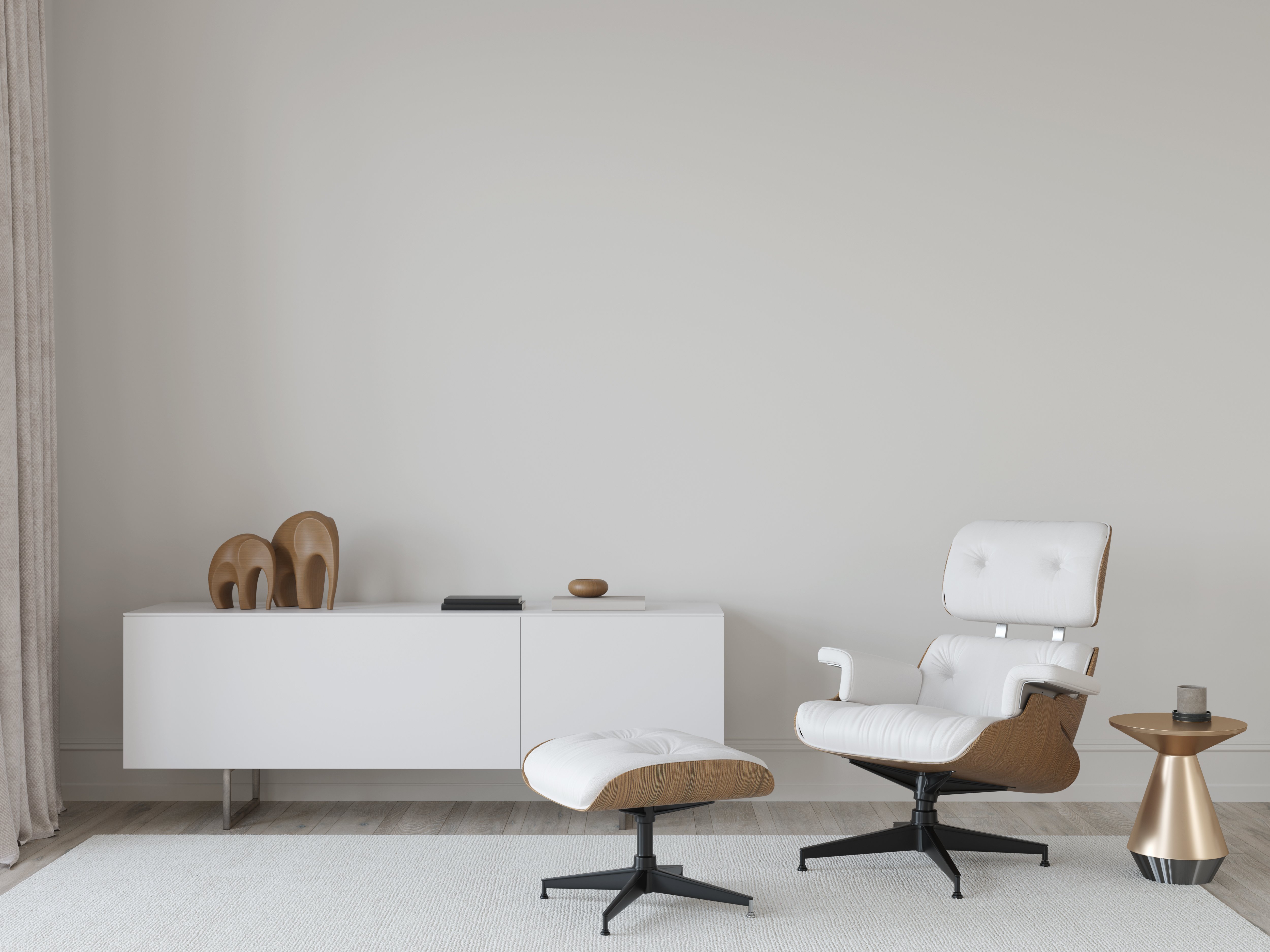 A modern white home office with wood elements, simple decor and a leather lounge chair